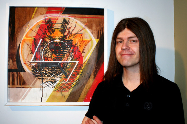 Jason Reed with one of his paintings at Start Gallery