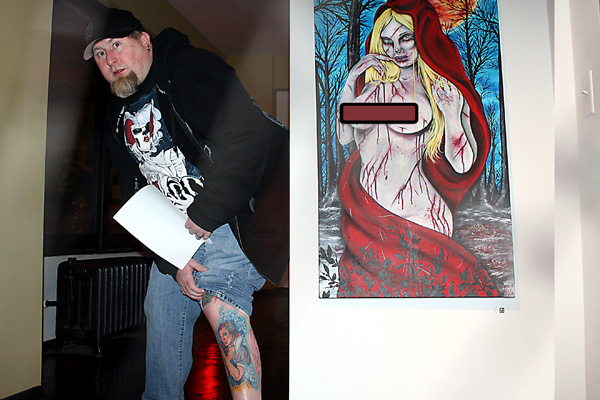 Todd Ponagai shows one of his tattoos to compare it to a painting